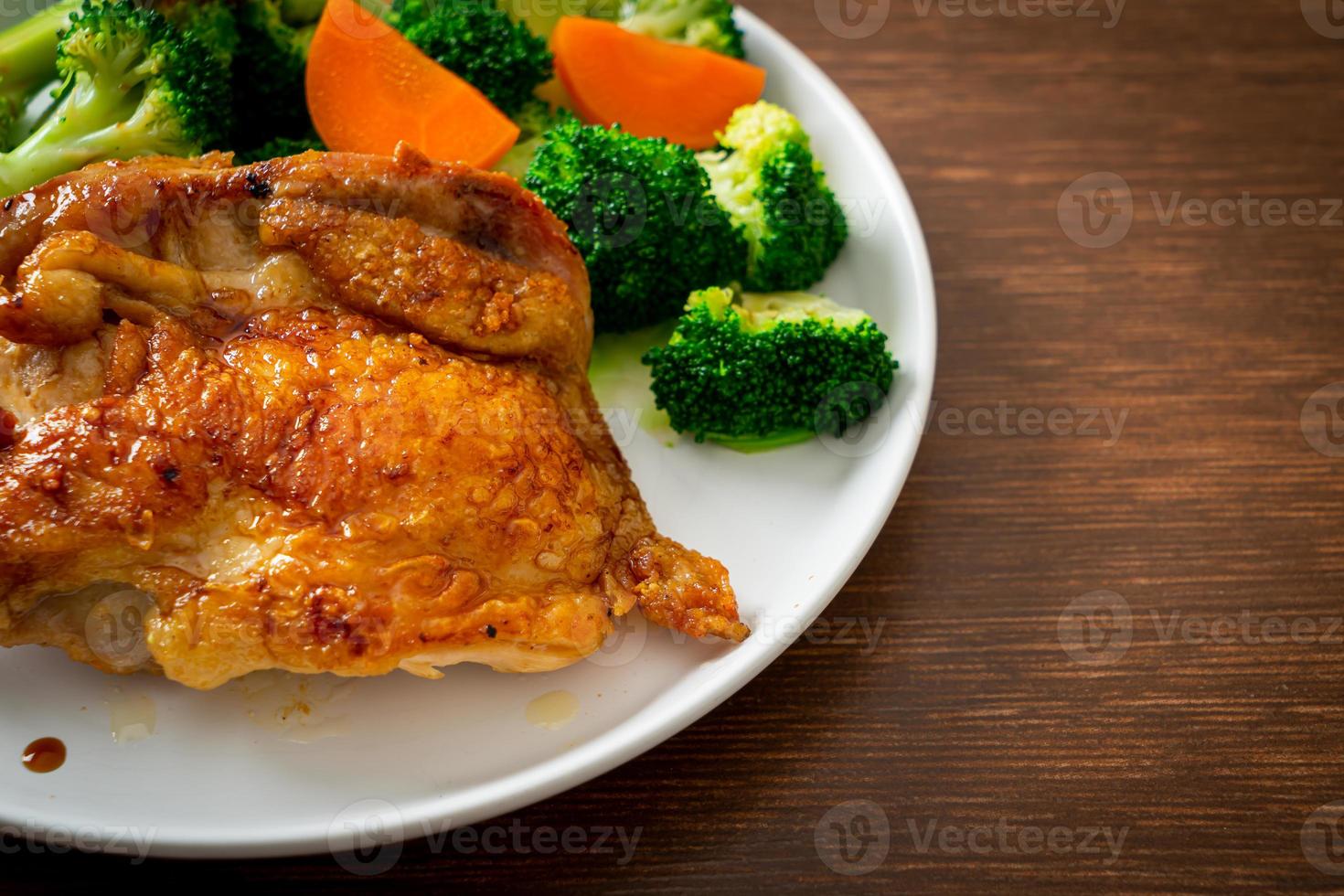 Teriyaki chicken steak with broccoli and carrot photo