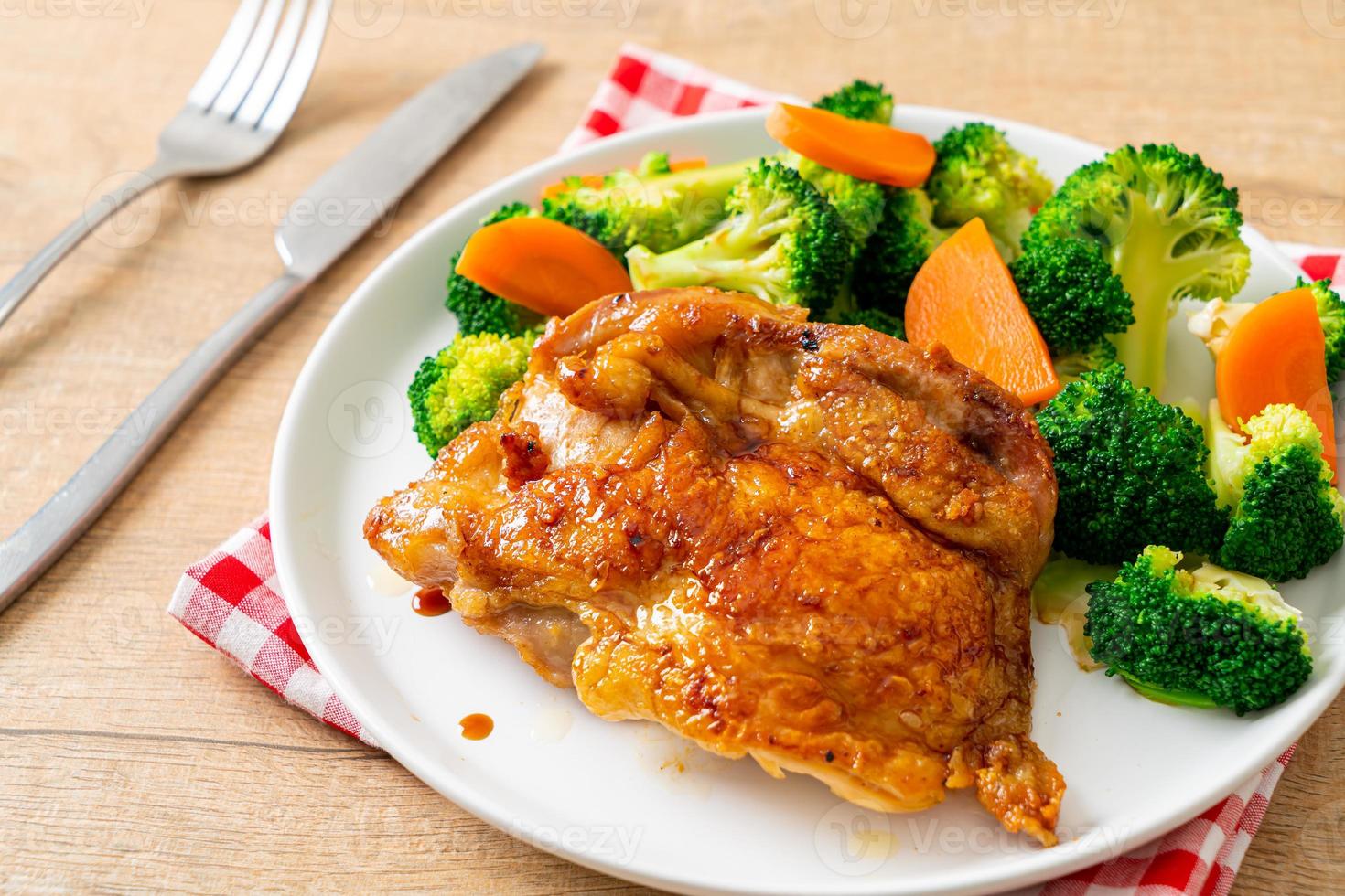 Teriyaki chicken steak with broccoli and carrot photo