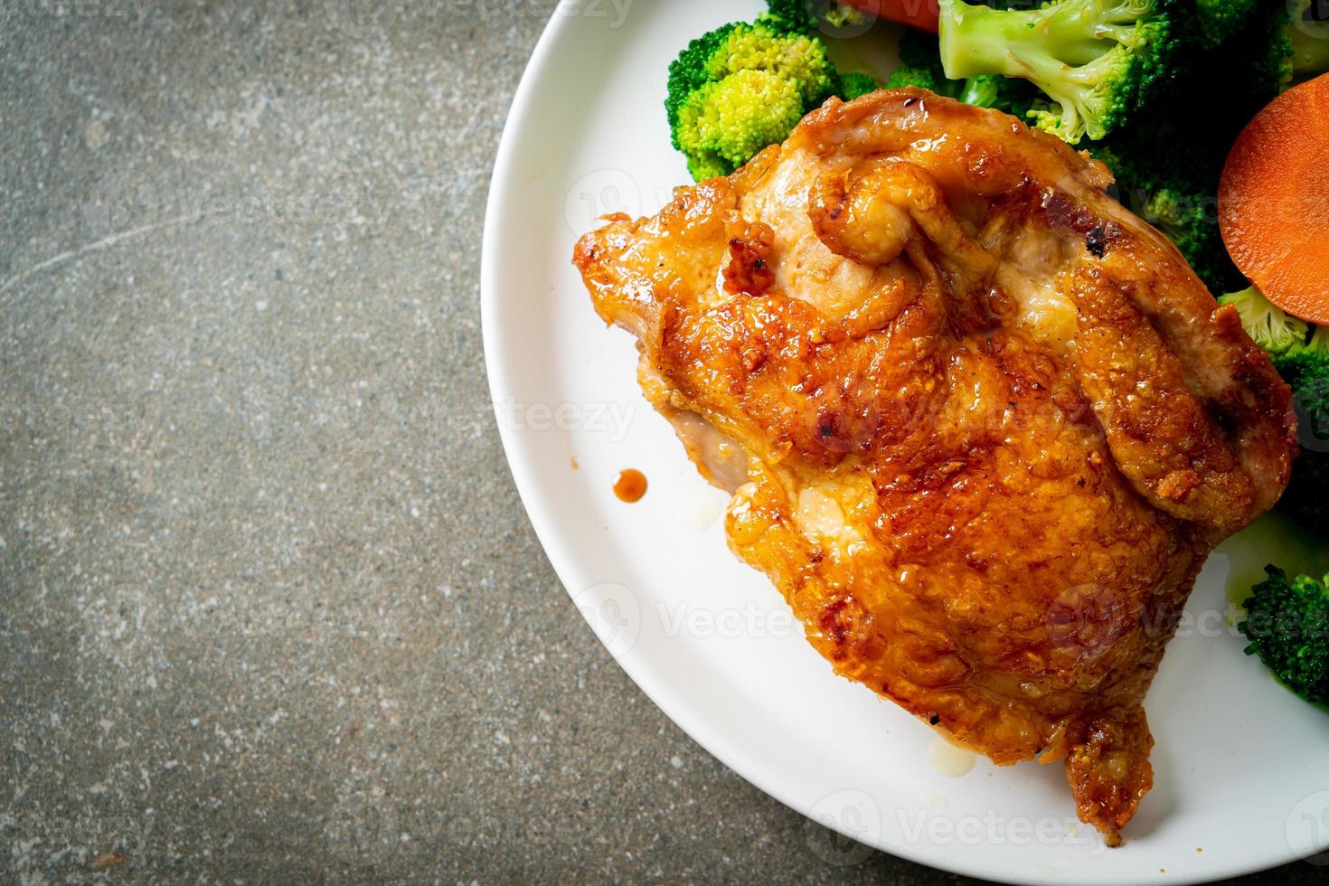 Teriyaki chicken steak with broccoli and carrot photo