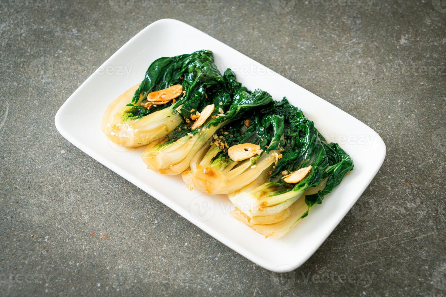 Baby Chinese cabbage with oyster sauce and garlic - Asian food style photo