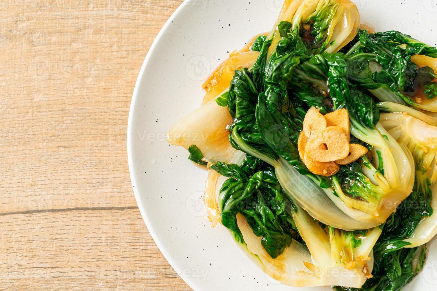 Baby Chinese cabbage with oyster sauce and garlic - Asian food style photo