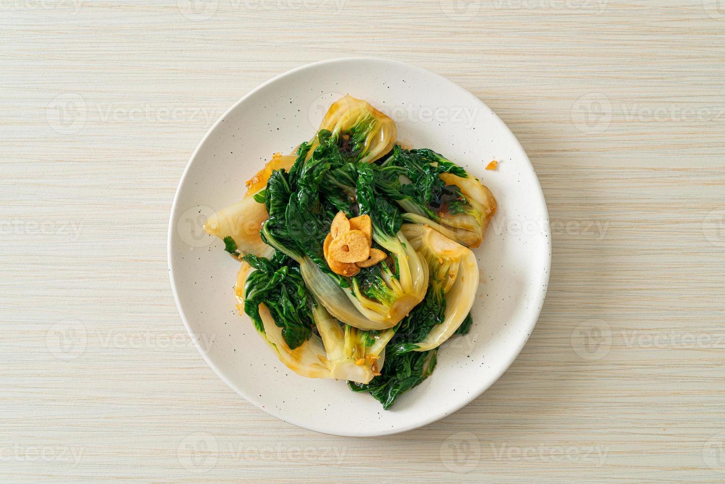 Baby Chinese cabbage with oyster sauce and garlic - Asian food style photo