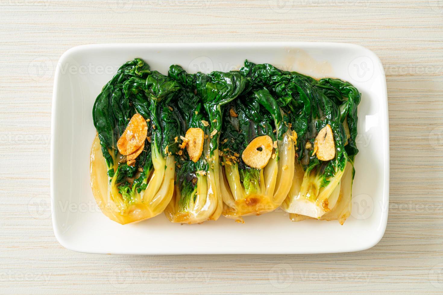 Baby Chinese cabbage with oyster sauce and garlic - Asian food style photo