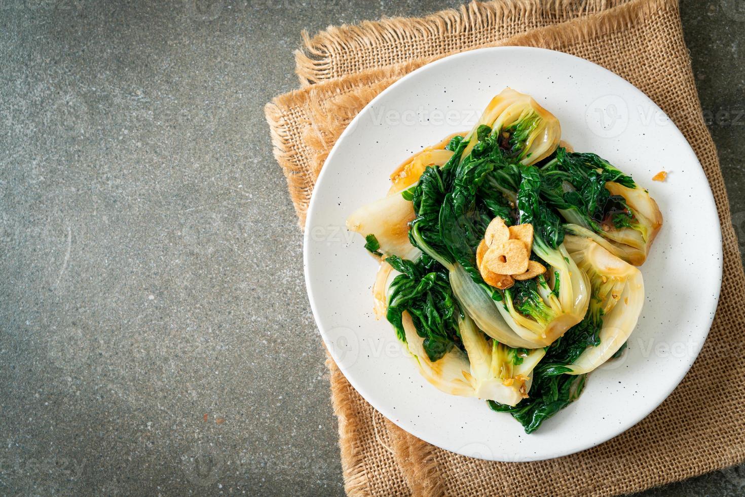 Baby Chinese cabbage with oyster sauce and garlic - Asian food style photo