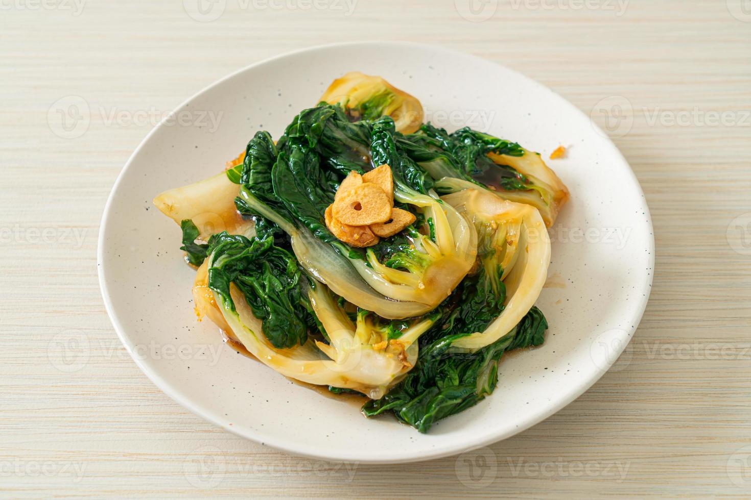 Baby Chinese cabbage with oyster sauce and garlic - Asian food style photo