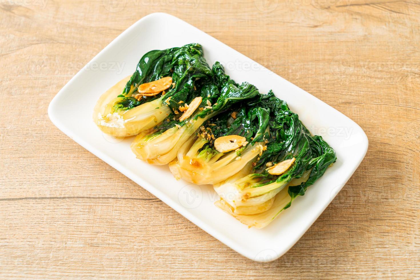 Baby Chinese cabbage with oyster sauce and garlic - Asian food style photo