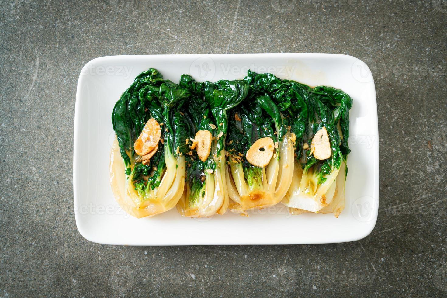 Baby Chinese cabbage with oyster sauce and garlic - Asian food style photo