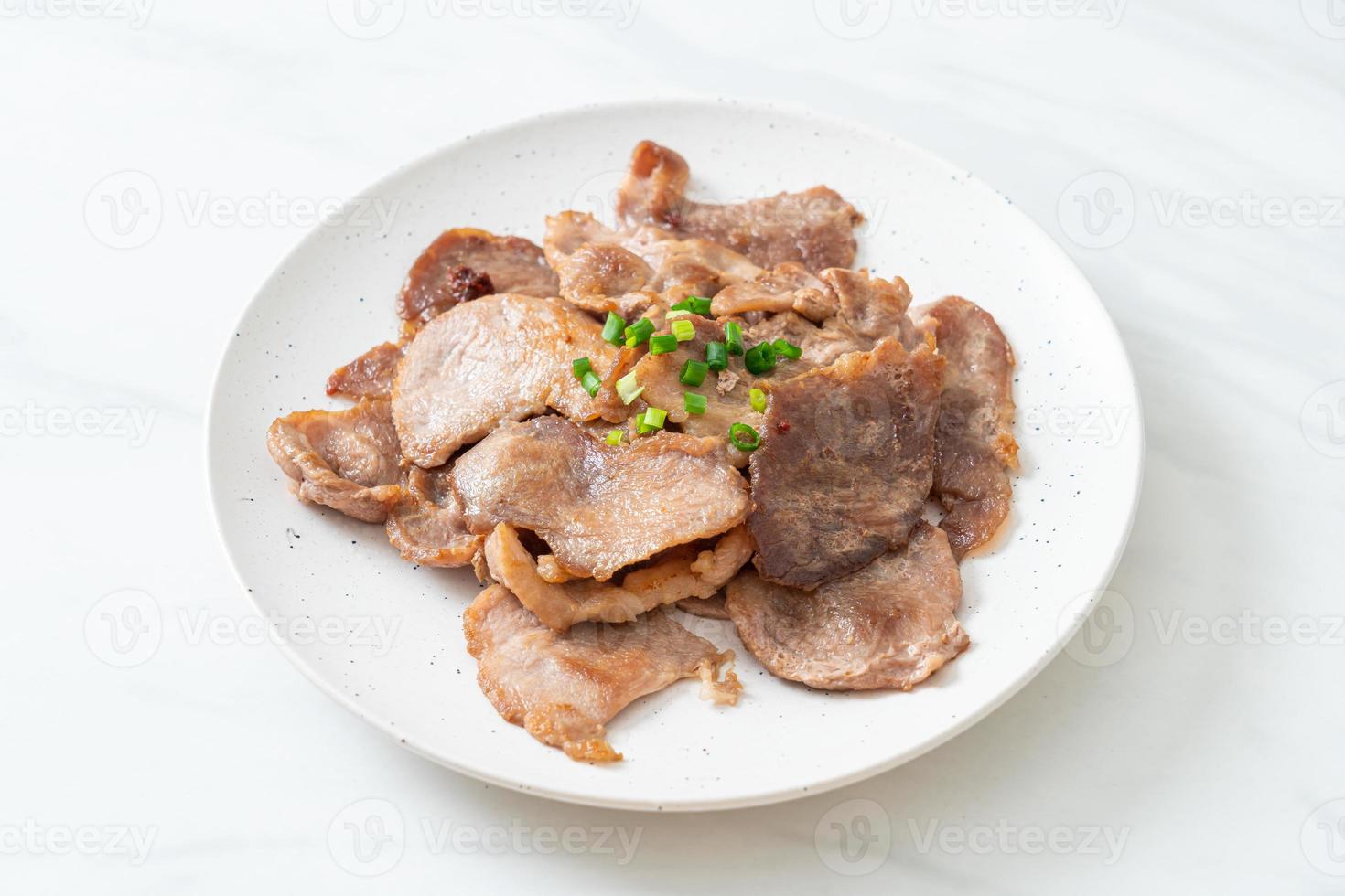 Grilled pork neck sliced on plate in Asian style photo