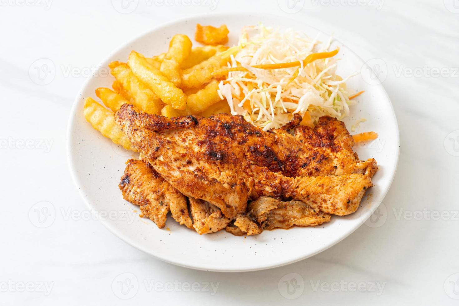 Grilled spicy barbecue chicken steak with french fries photo