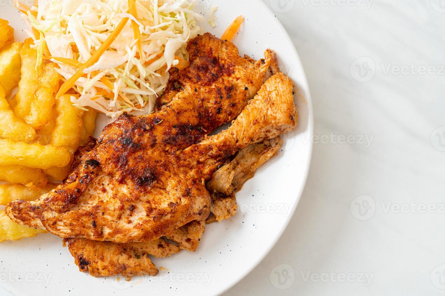 Grilled spicy barbecue chicken steak with french fries photo