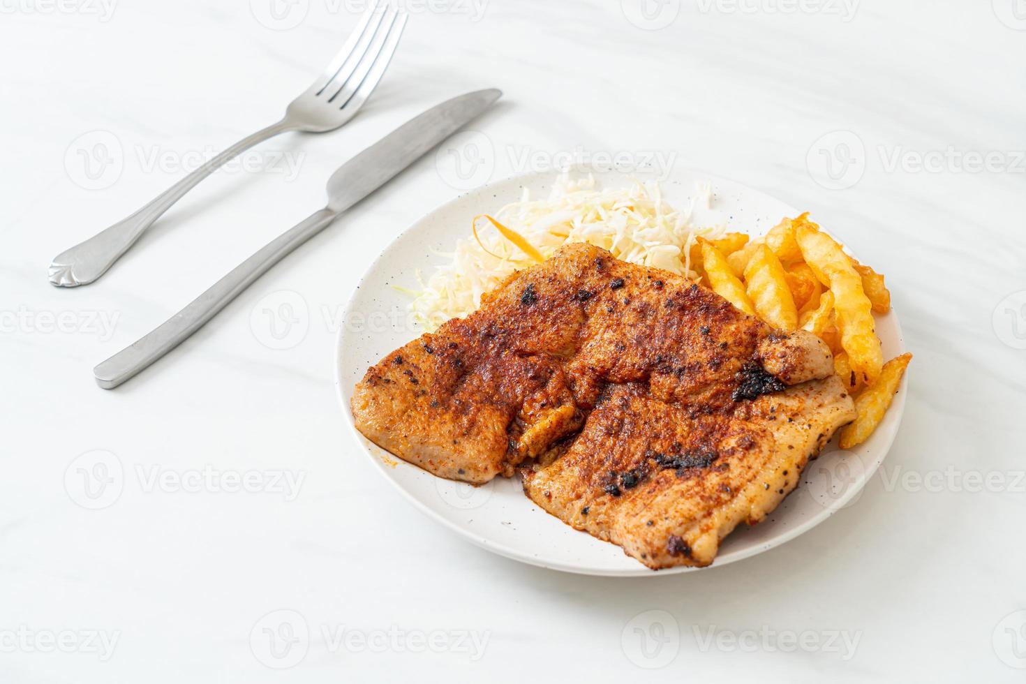 Grilled spicy barbecue kurobuta pork steak with french fries photo