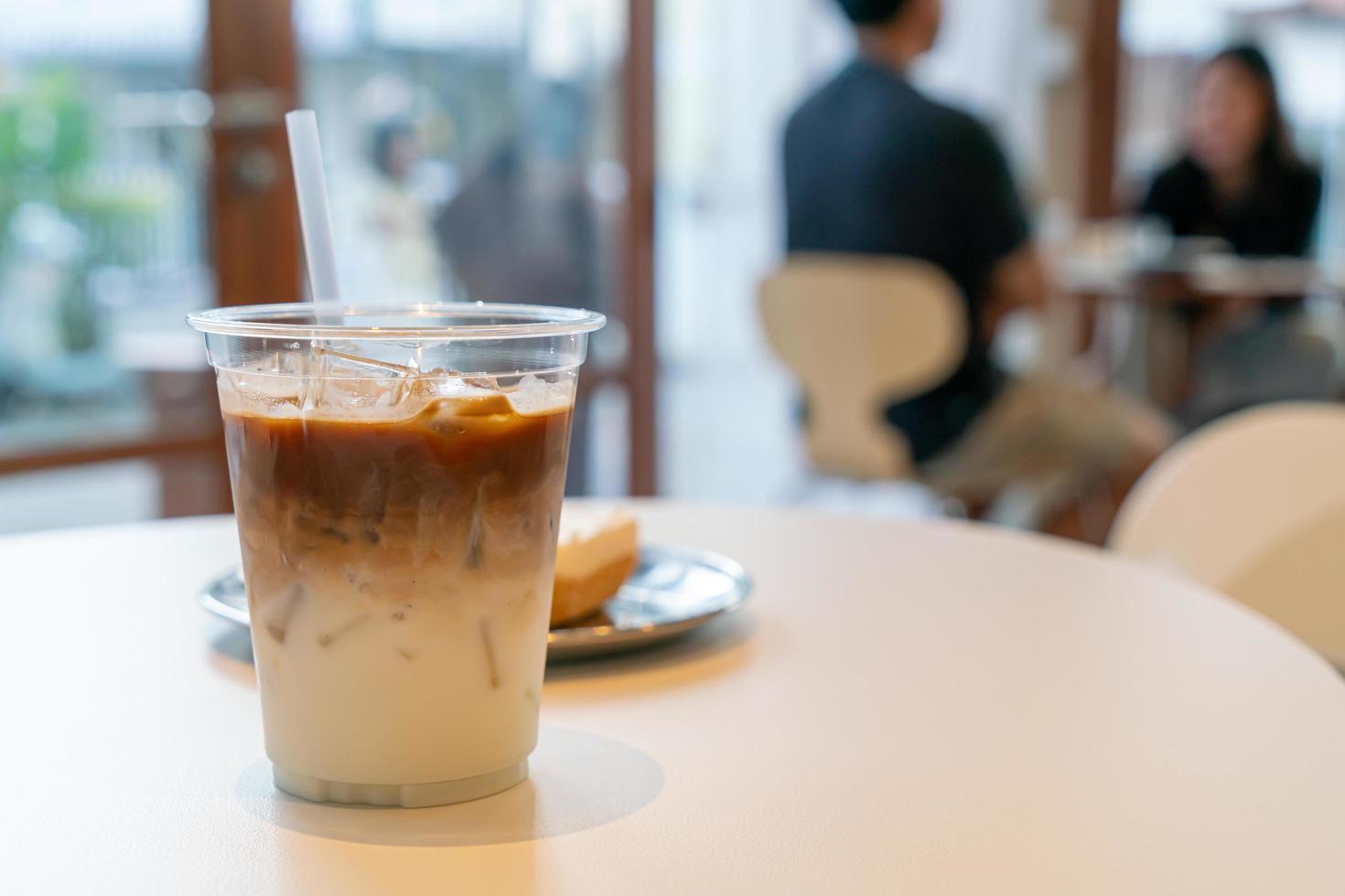 Iced latte coffee cup in cafe restaurant photo