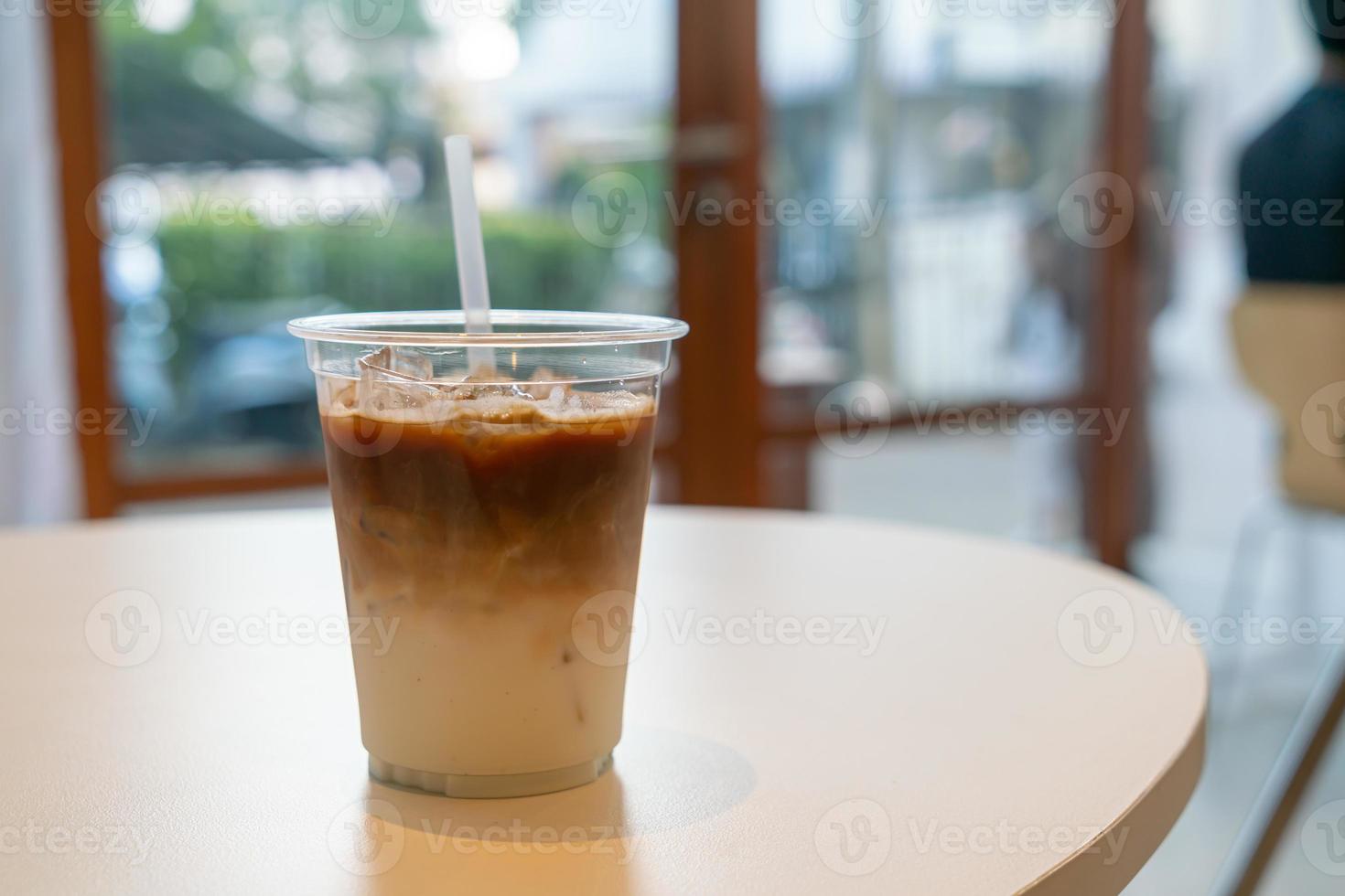 Iced latte coffee cup in cafe restaurant photo