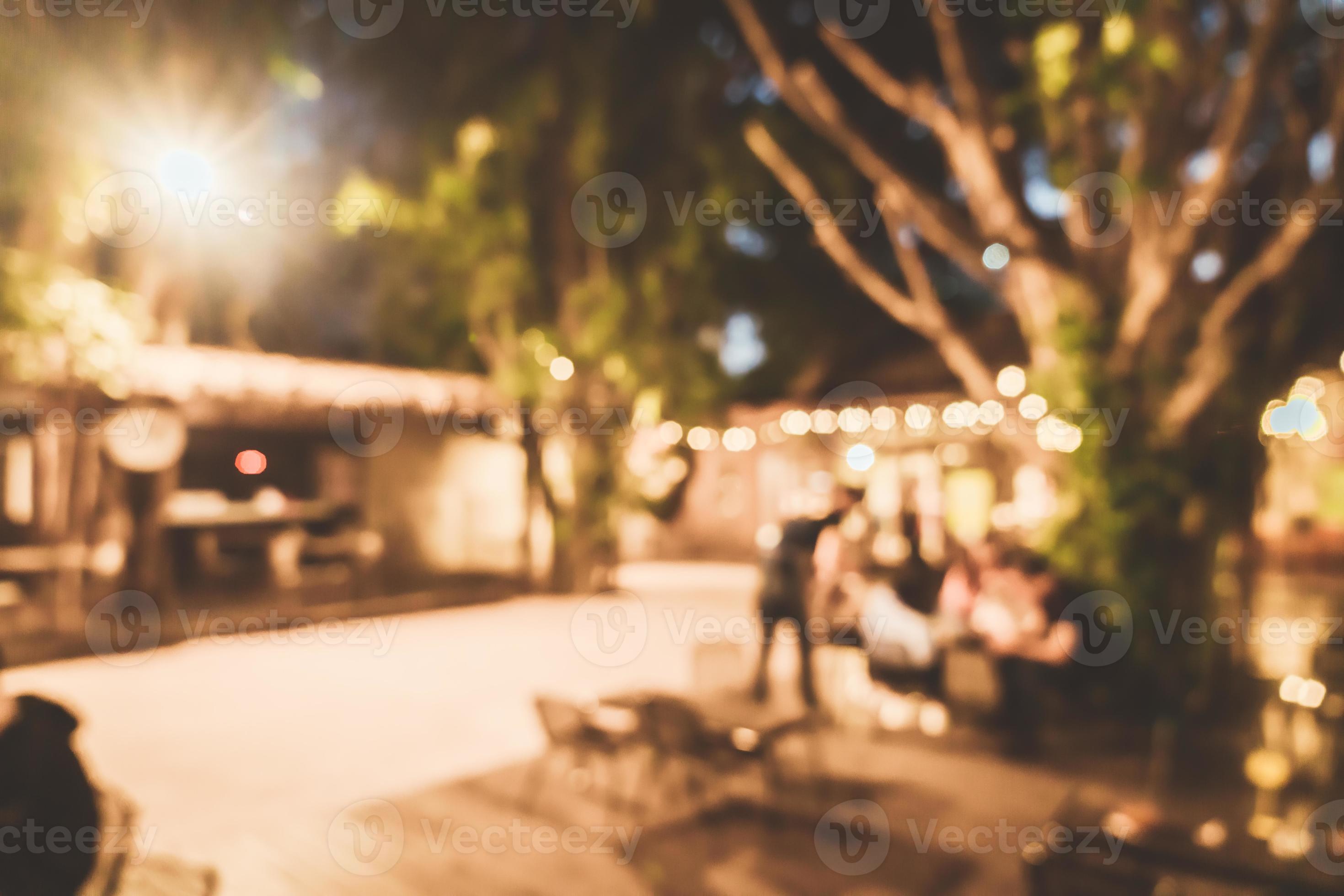 Abstract blur outdoor hangout courtyard in cafe restaurant at night for
