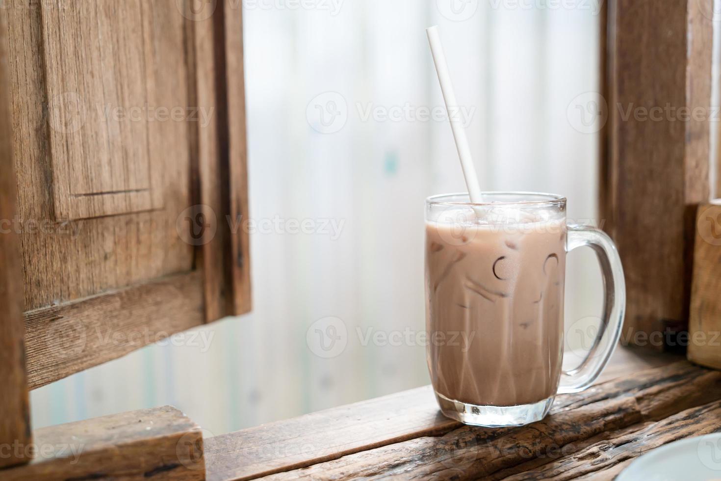 Iced chocolate milkshake glass in cafe restaurant photo