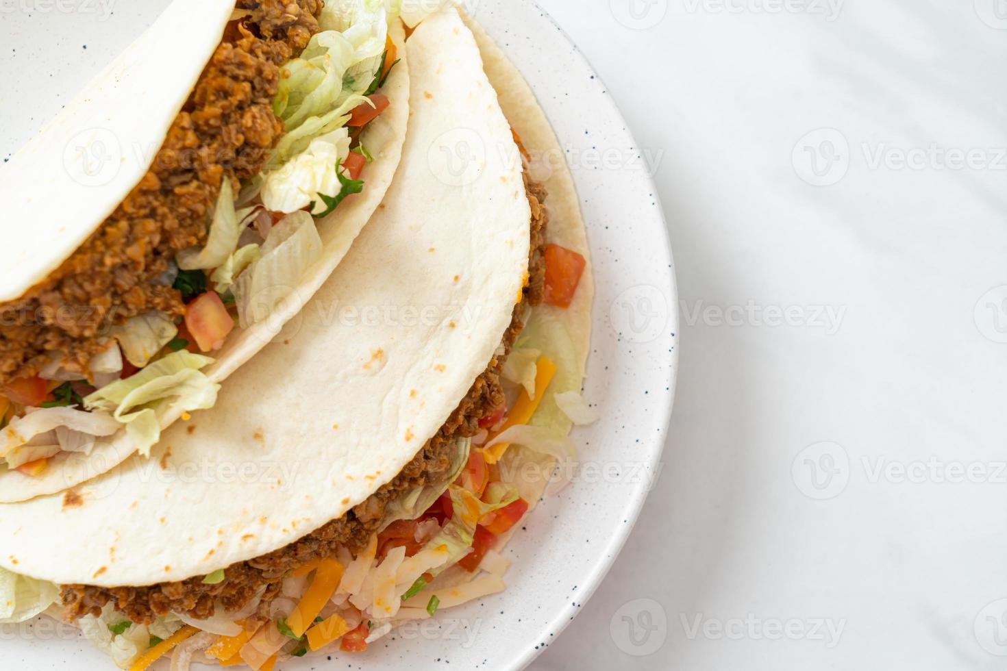 Mexican tacos with minced chicken photo