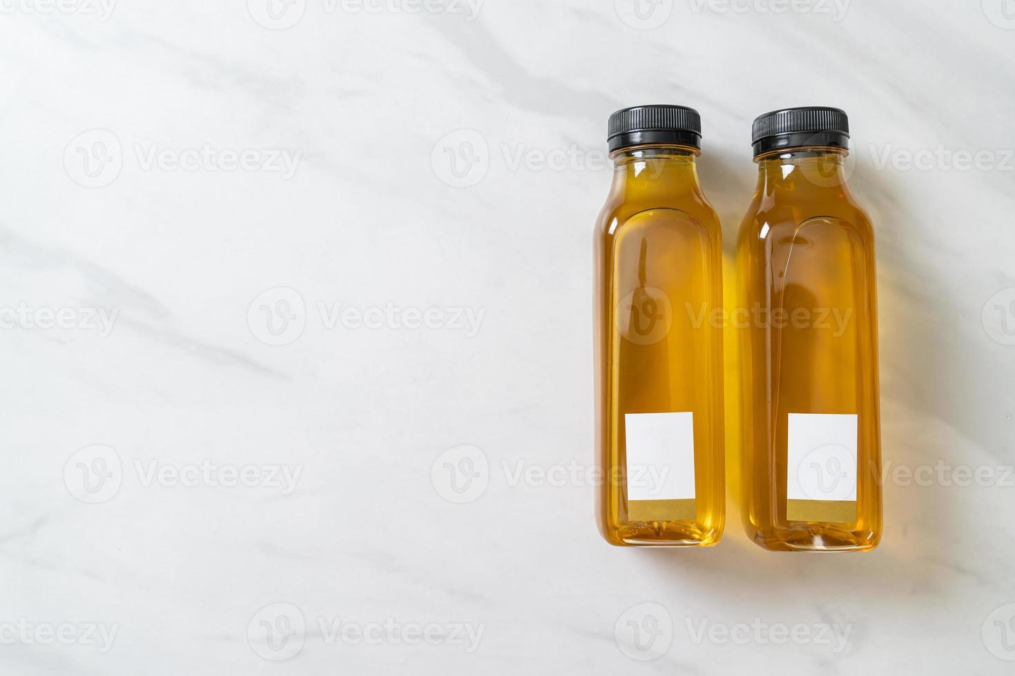Chrysanthemum juice bottle on marble background photo