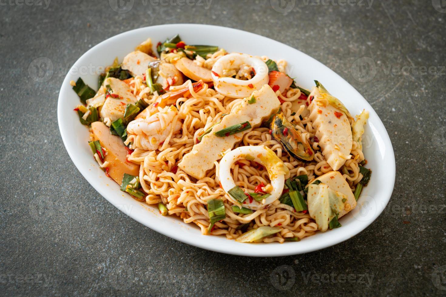 Instant noodle spicy salad with mixed meats photo