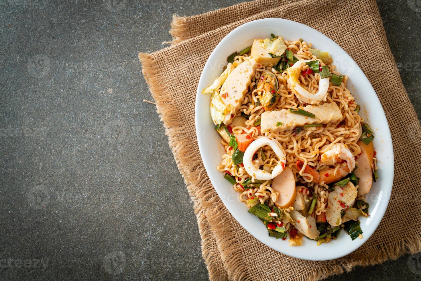 Instant noodle spicy salad with mixed meats photo