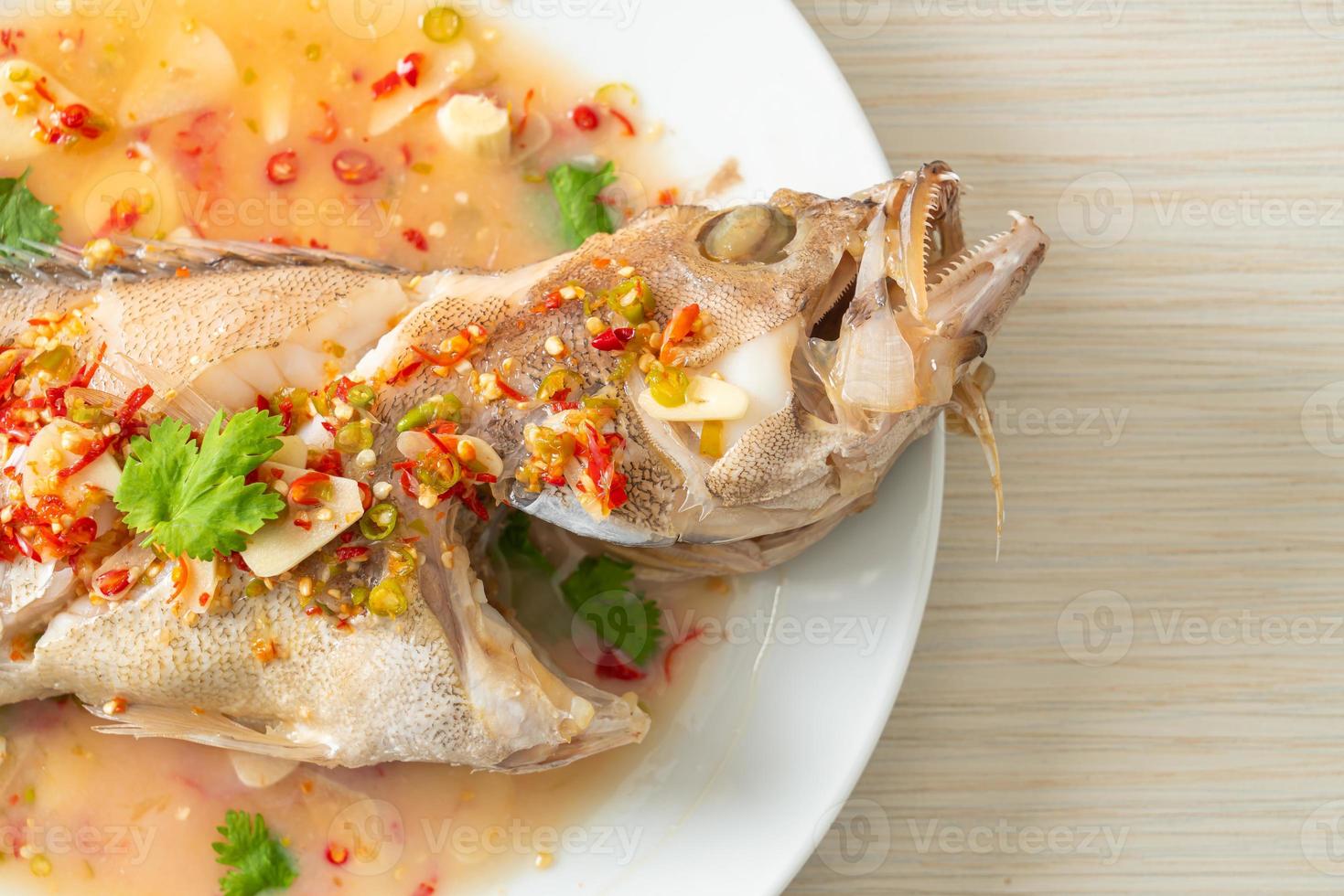 Steamed grouper fish with lime and chillies photo