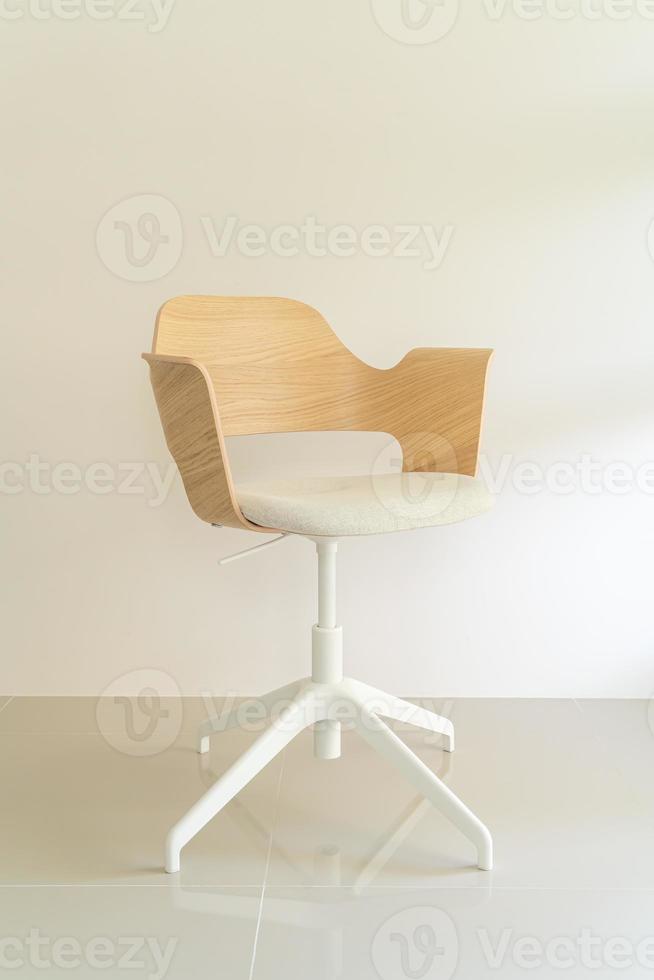 Wood chair with grey fabric seat photo