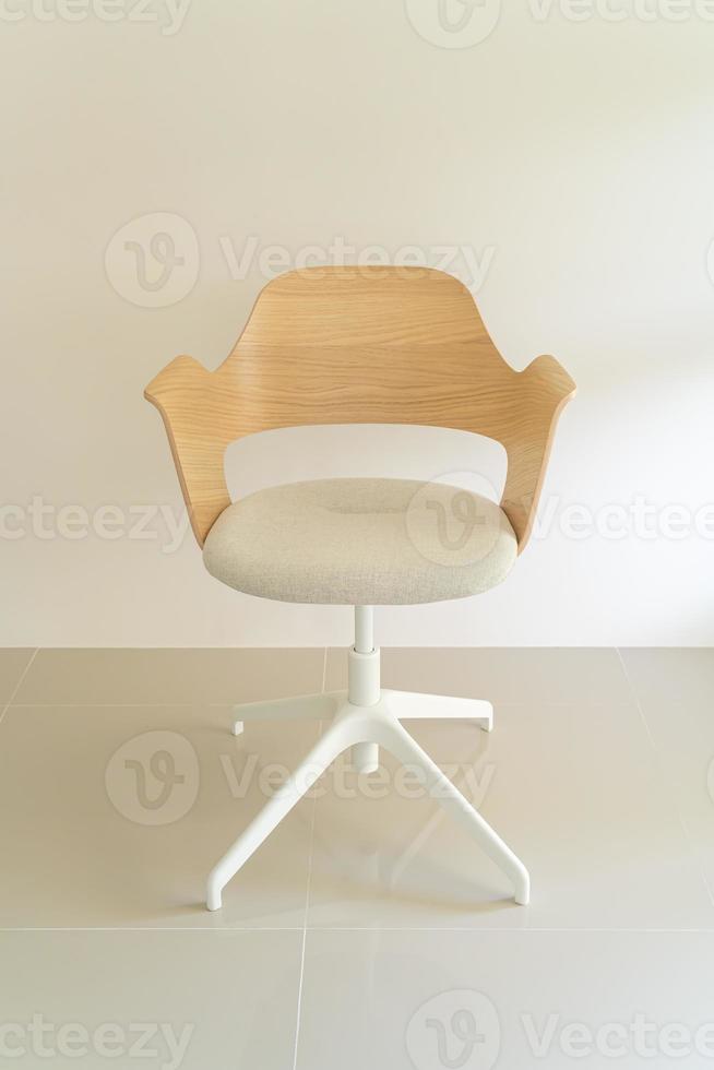 Wood chair with grey fabric seat photo