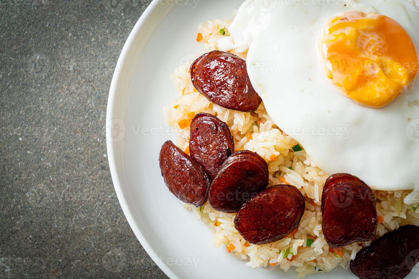 Fried rice with fried egg and Chinese sausage - Homemade food in Asian style photo