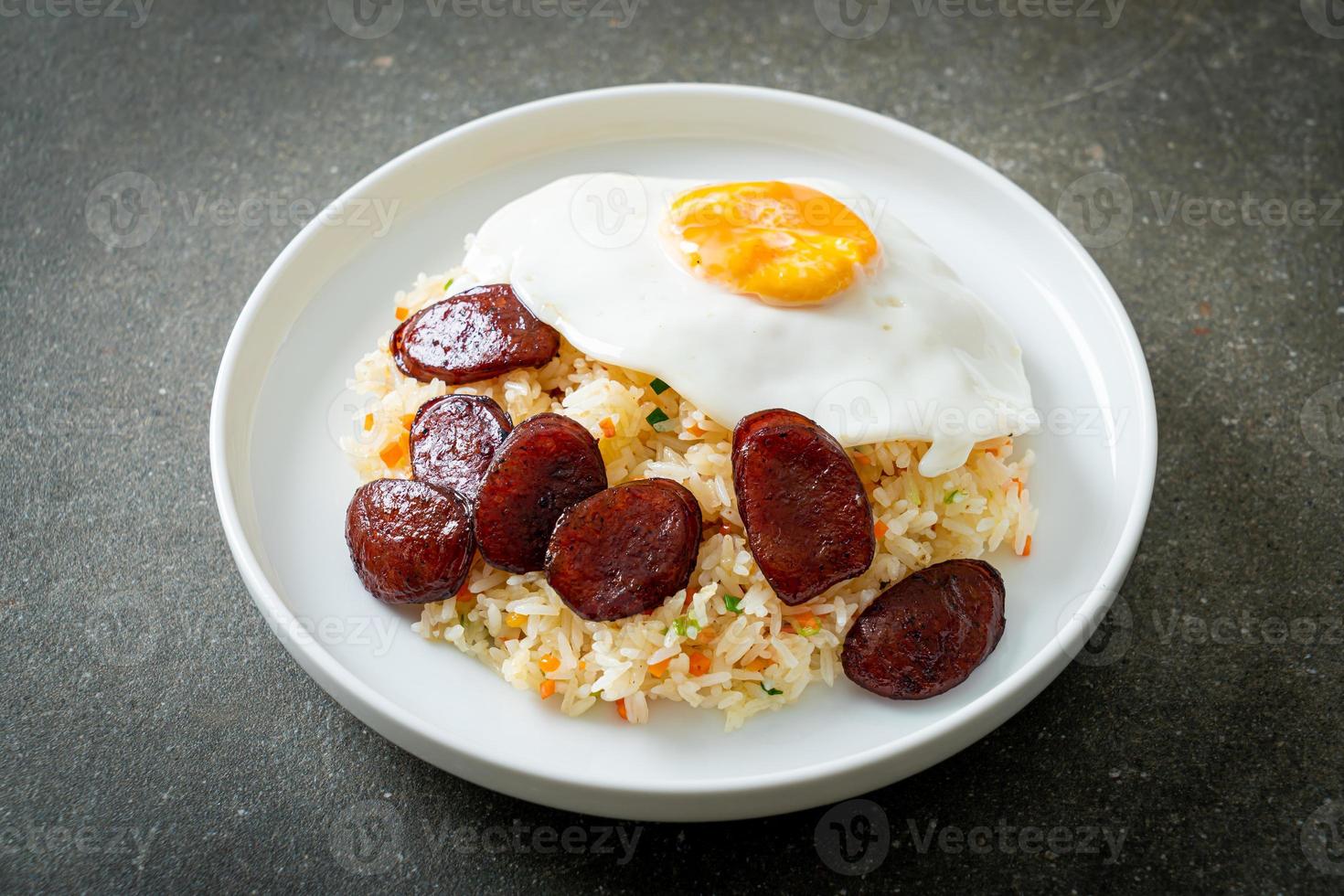 Fried rice with fried egg and Chinese sausage - Homemade food in Asian style photo