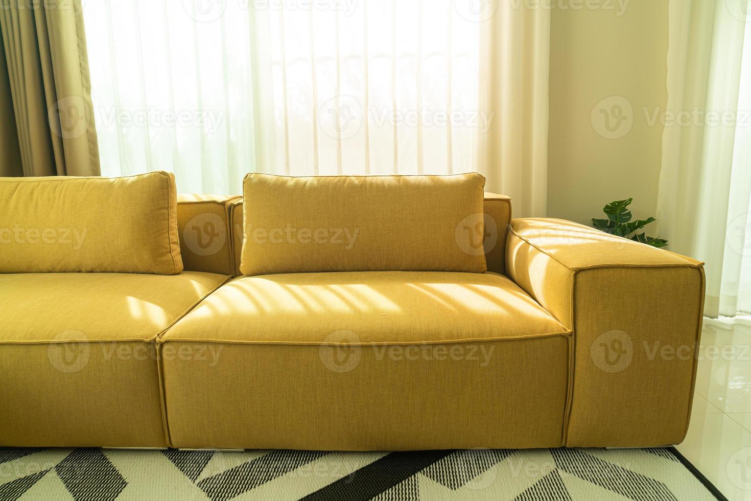 Empty golden mustard sofa in living room photo