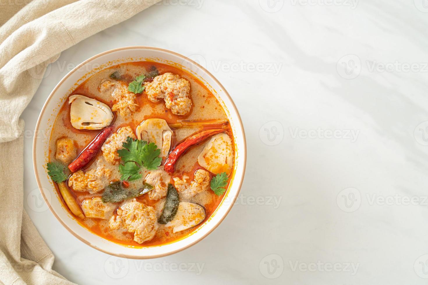 Spicy boiled pork soup with mushroom - Tom Yum - Asian food style photo