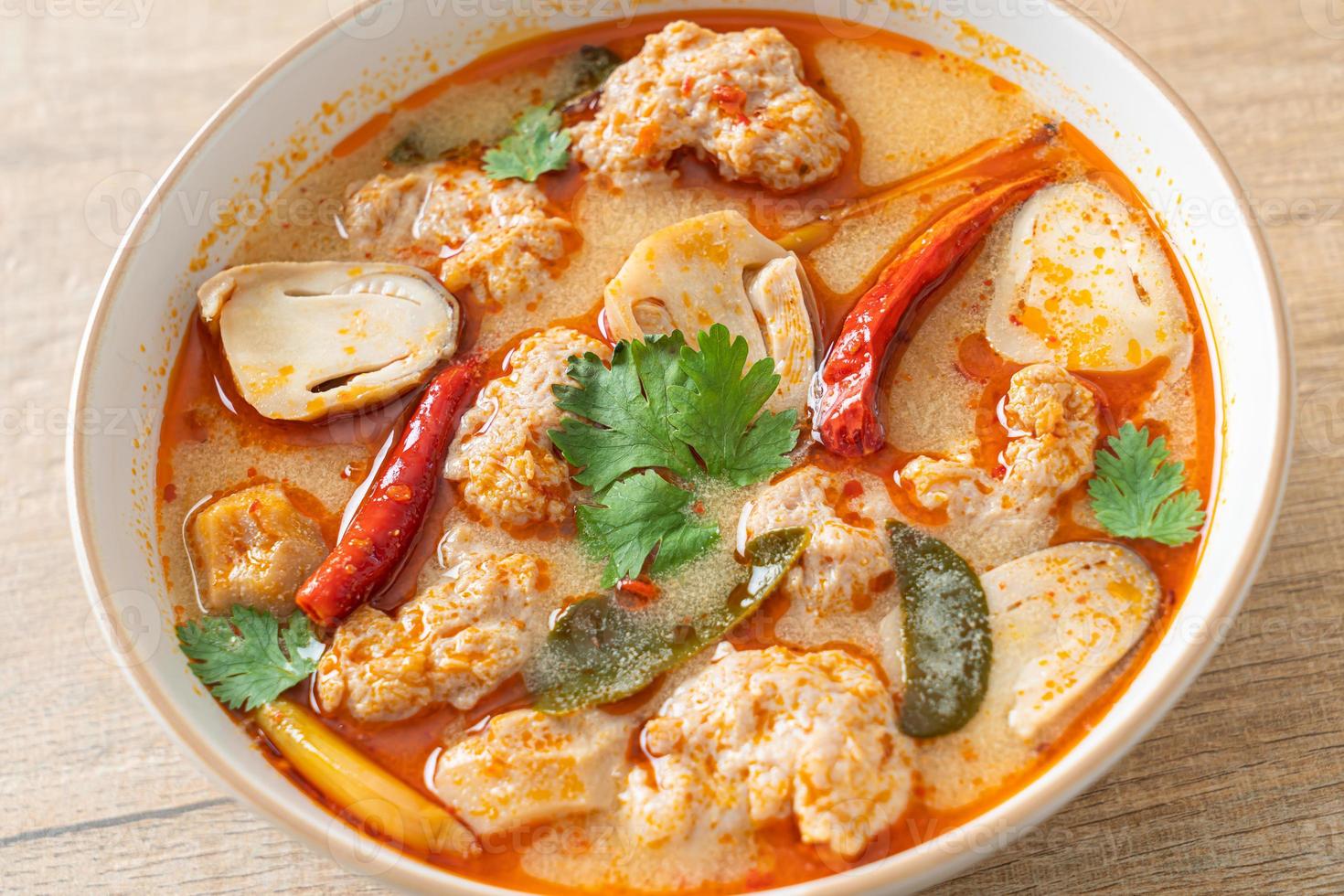 Spicy boiled pork soup with mushroom - Tom Yum - Asian food style photo