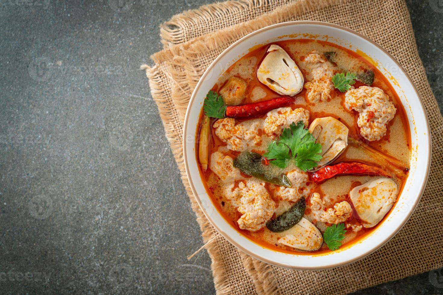Spicy boiled pork soup with mushroom - Tom Yum - Asian food style photo