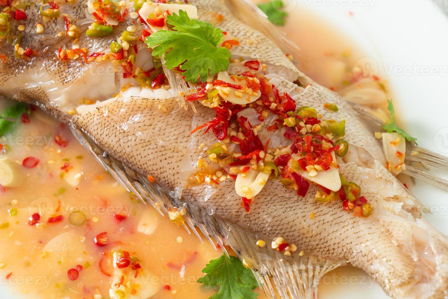 Steamed grouper fish with lime and chillies photo