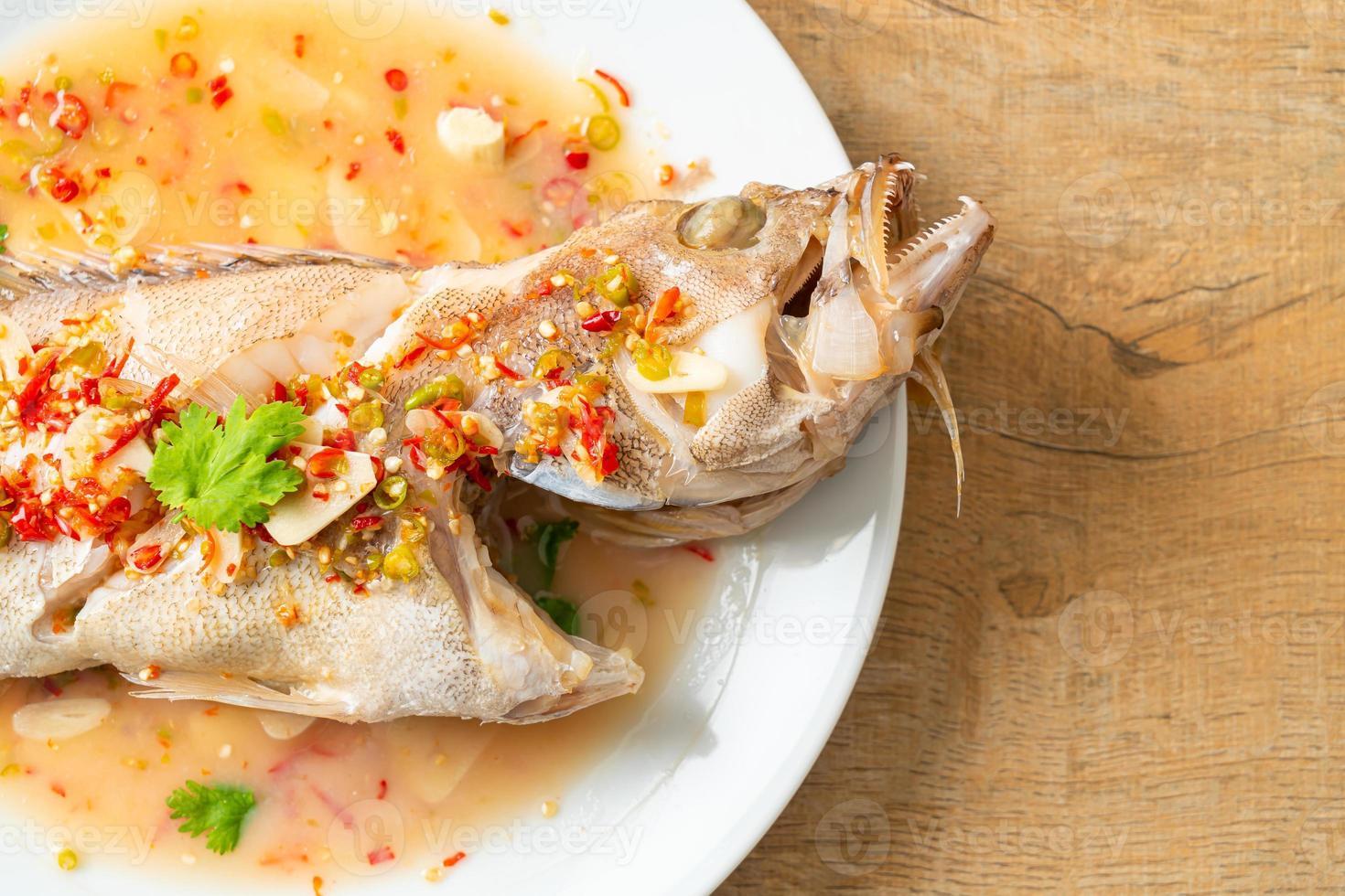 Steamed grouper fish with lime and chillies photo