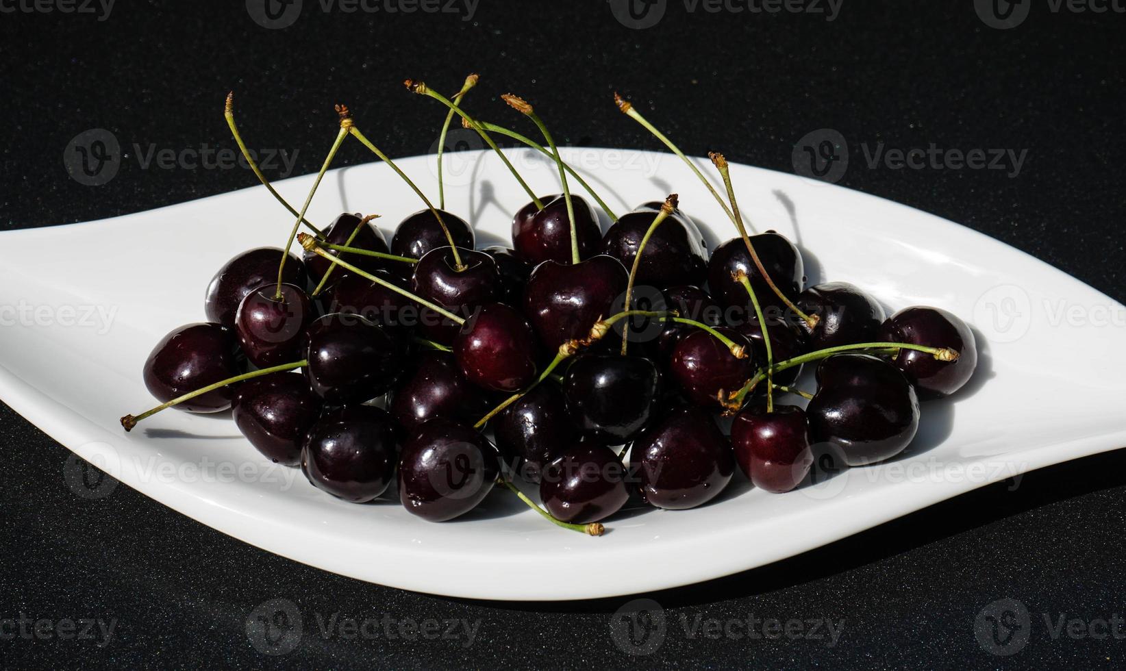 a stack of dark sweet cherries photo