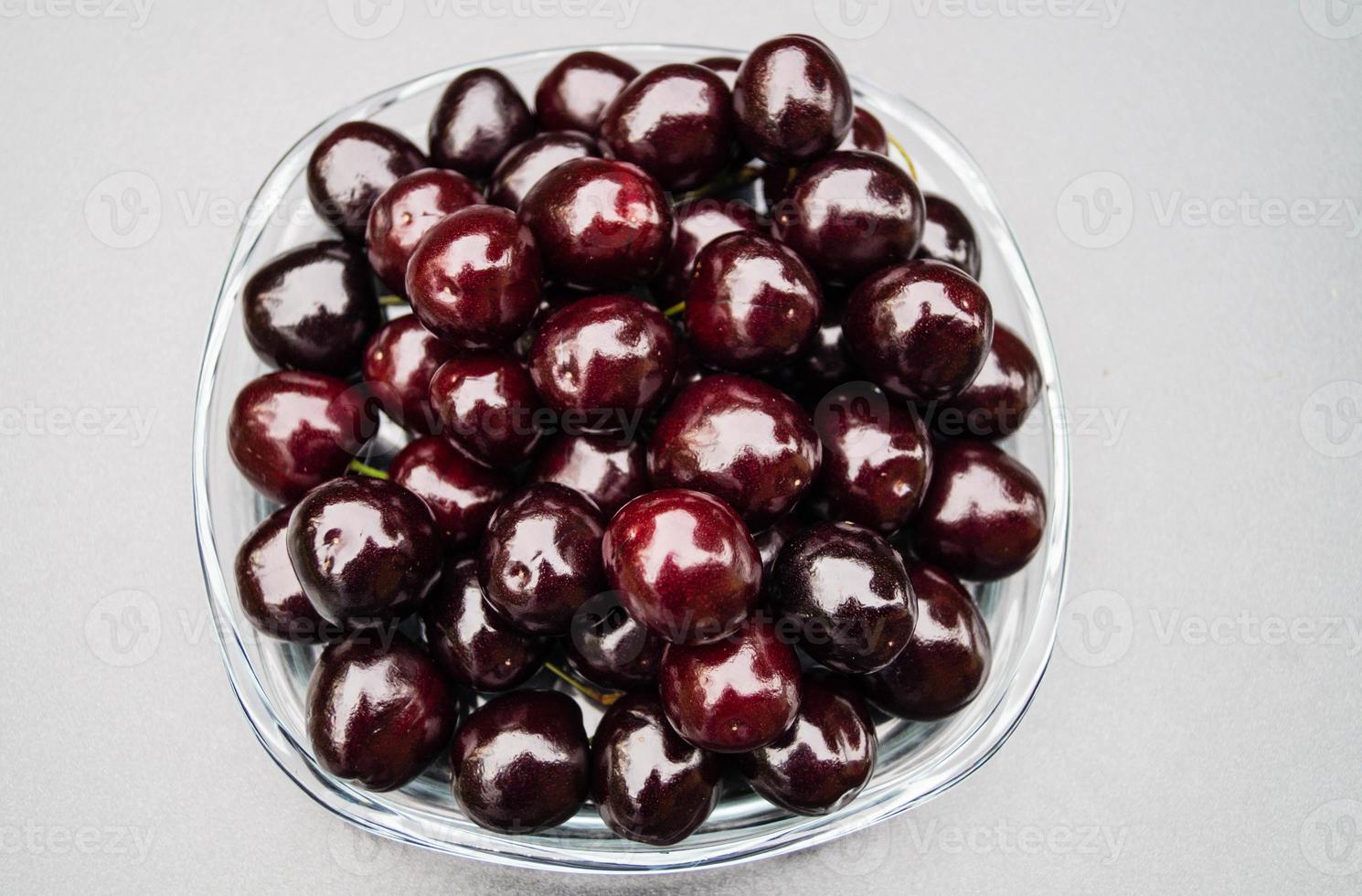 a stack of dark sweet cherries photo