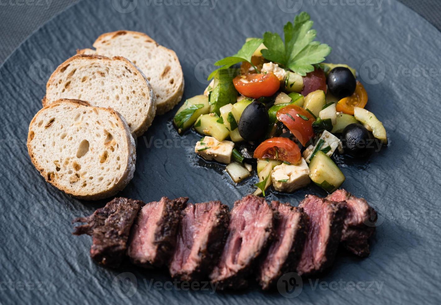 grilled Kidney cones beef with bread and salad photo