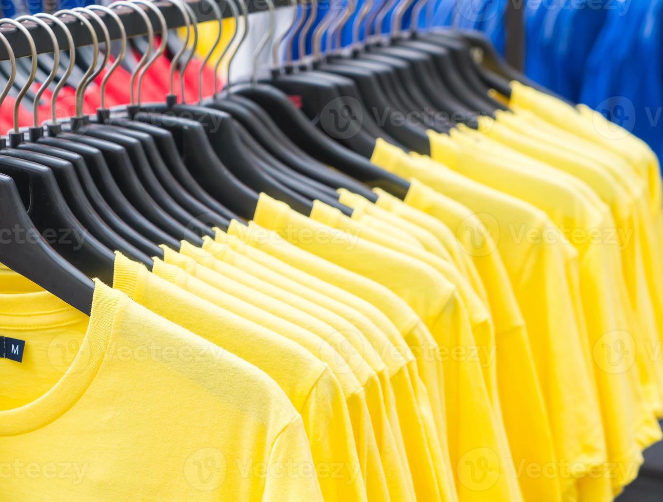 Clothes hang on shelf photo