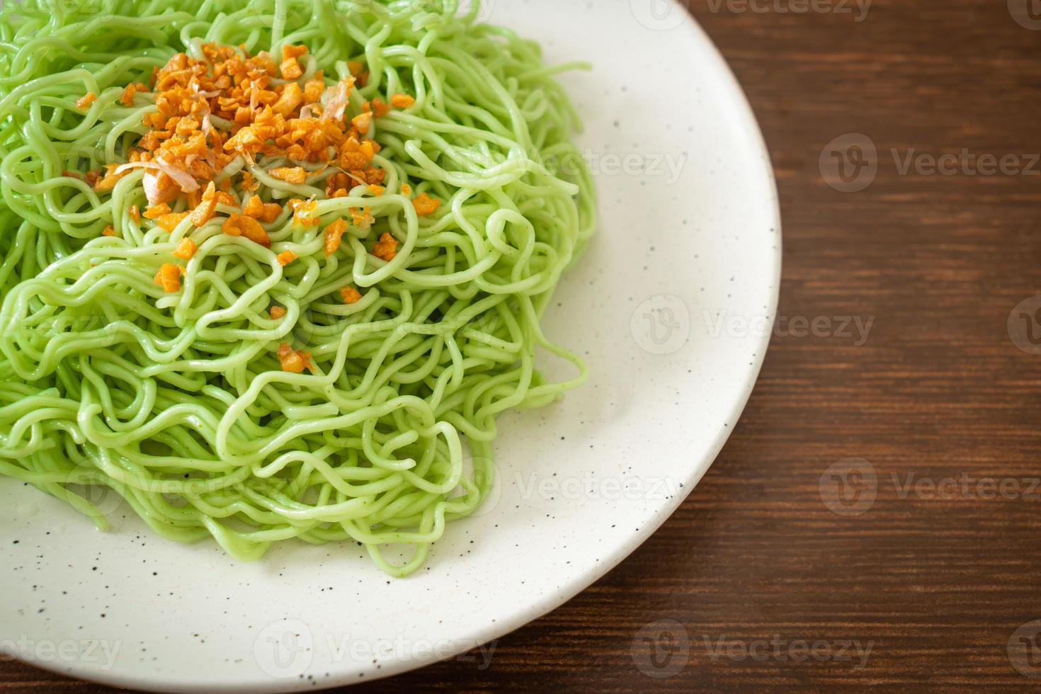 Green jade noodle with garlic on plate photo