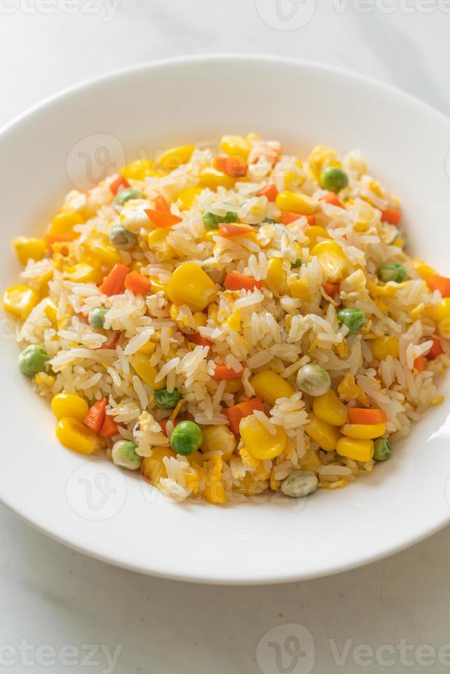 Homemade fried rice with mixed vegetables of carrot, green bean peas