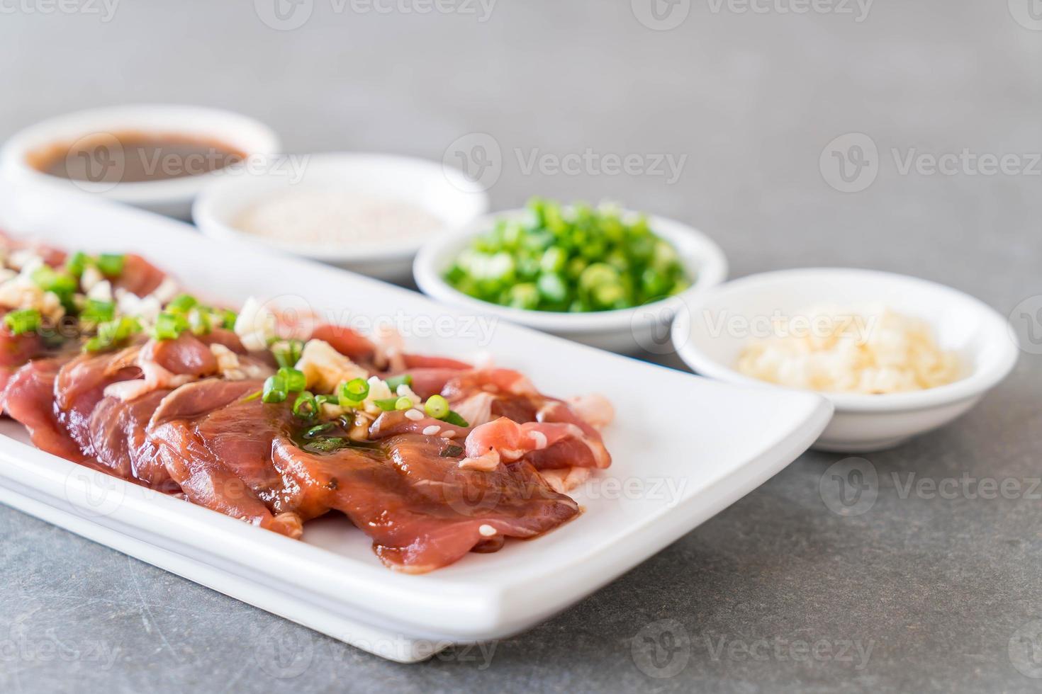 Fresh pork sliced on white background photo