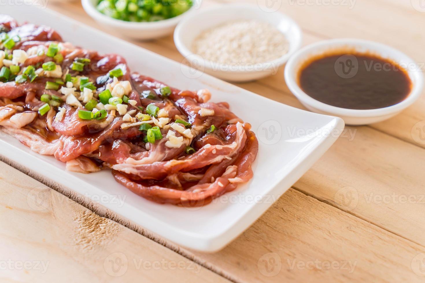 Fresh pork sliced on white background photo