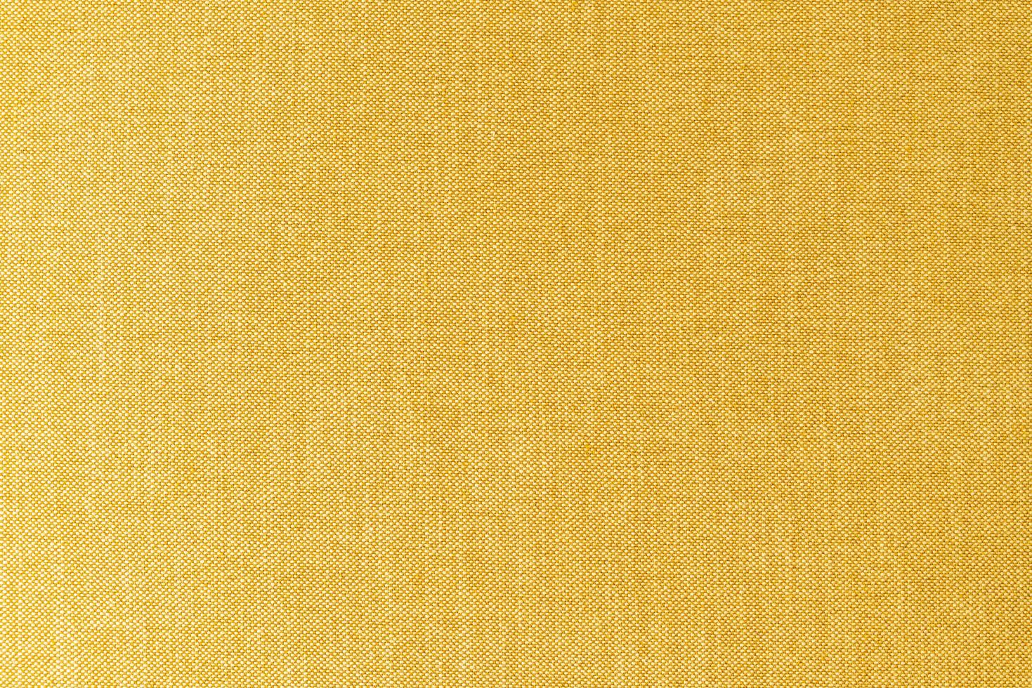 Close-up yellow or golden mustard fabric surface texture for background photo