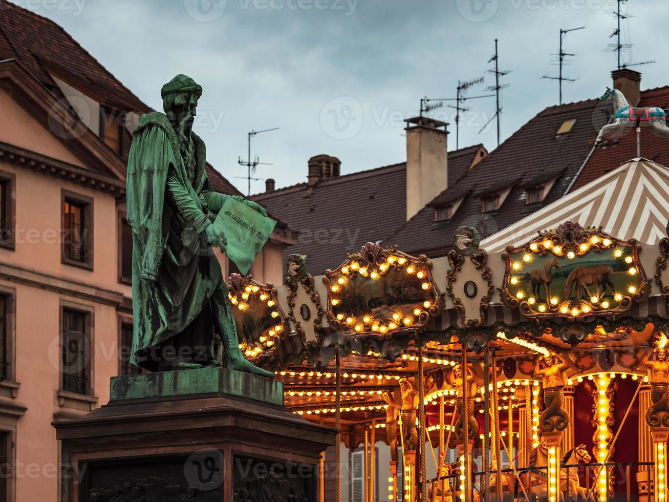 Glowing lights of a classic French carousel in Strasbourg, France photo