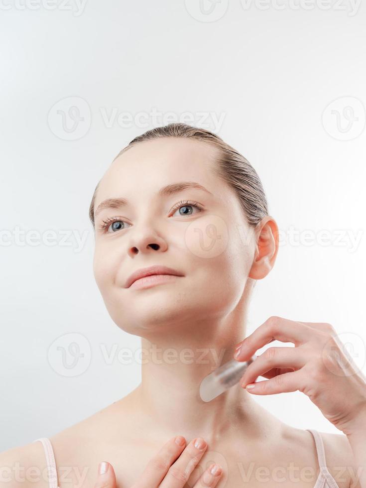 Beautiful Young Woman with Clean Fresh Skin photo