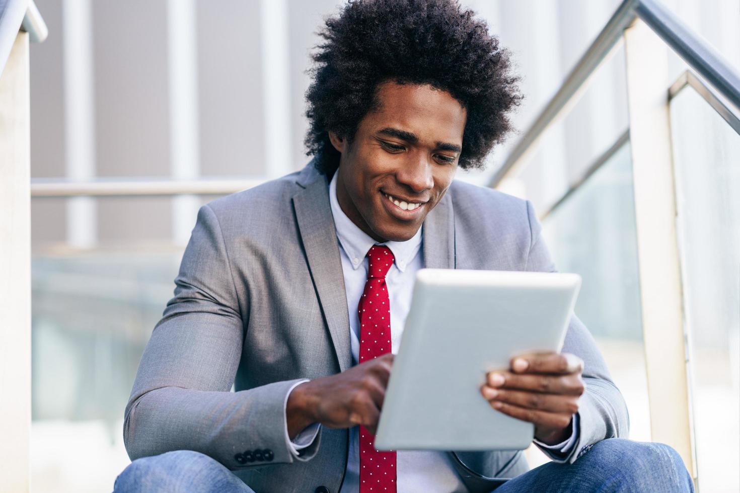 Black Businessman using a digital tablet photo