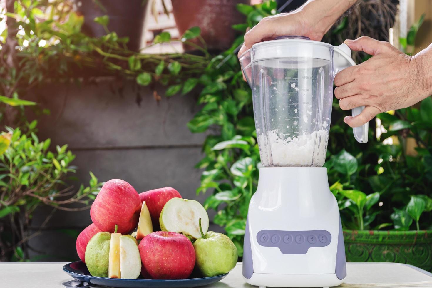 Making fresh apple and guava juice photo