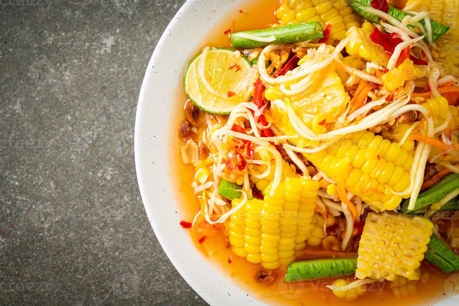 Som Tum - Thai spicy papaya salad with corn photo