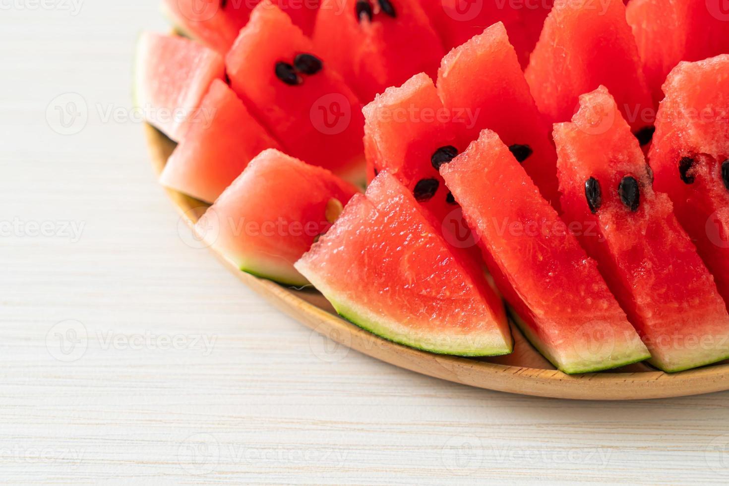 Fresh watermelon sliced on plate photo