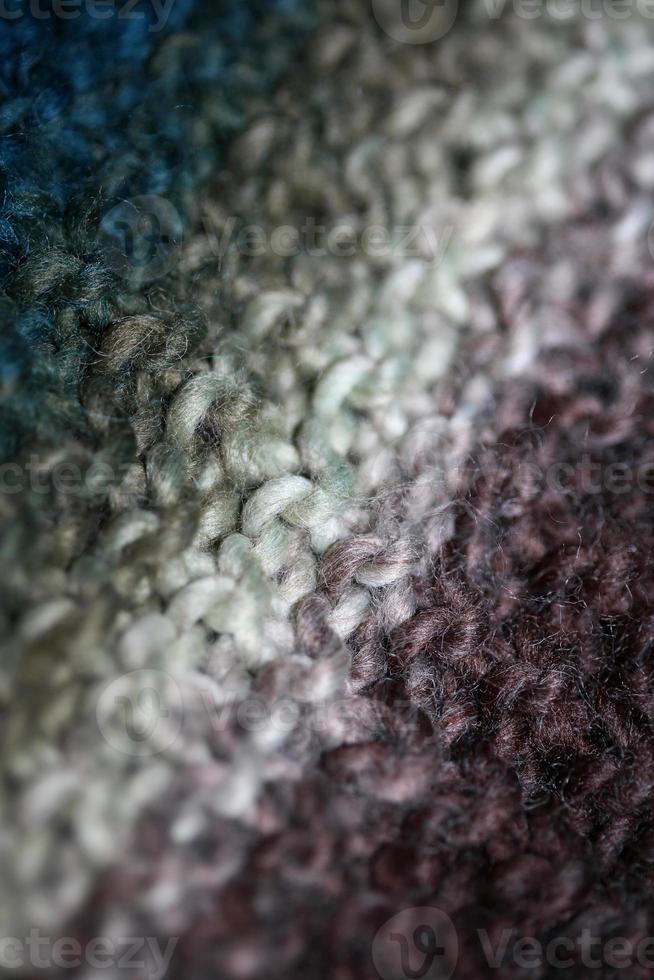 Colorful handmade winter scarf with alpacas wool close up photo